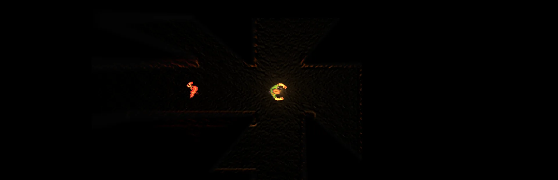 A torch-lit corridor of rough cave rock, the light falling away into darkness on both sides.